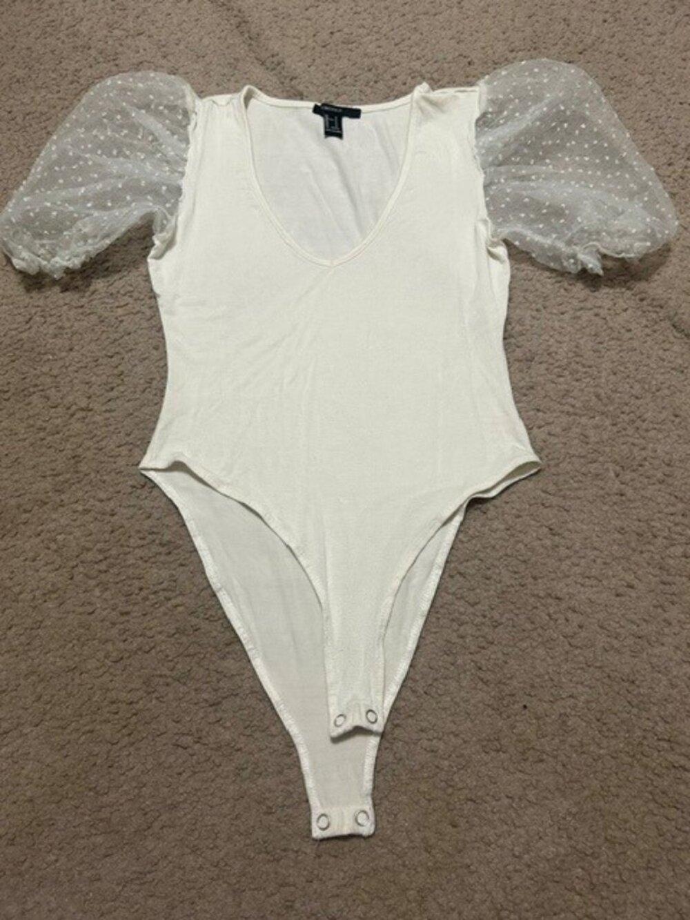 Forever 21 V-neck bodysuit featuring sheer polka-dot mesh puff sleeves.